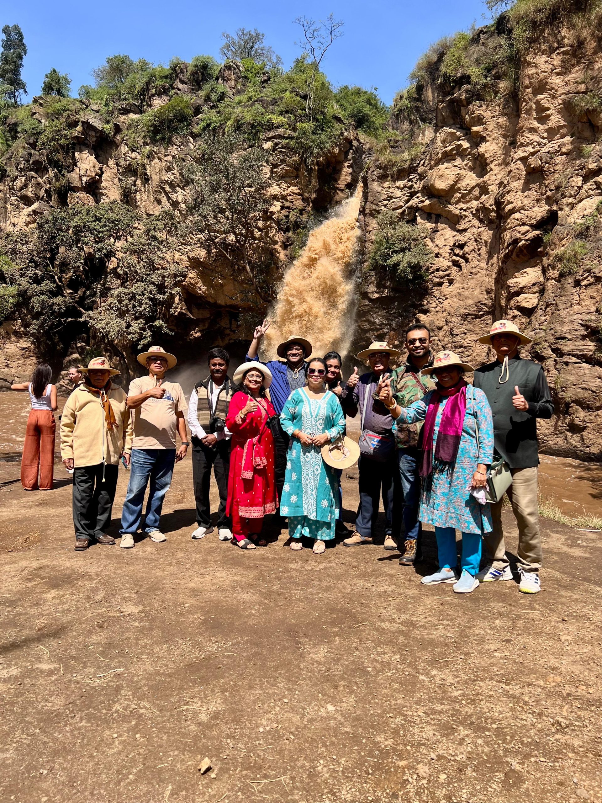 Our guests taking a picture at Makalia Falls in Lake Nakuru National Park